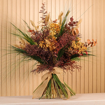 Ramo de flores preservadas Oasis con tonos verdes intensos, ocres y granates para decoración natural
