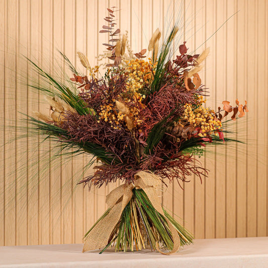 Ramo de flores preservadas Oasis con tonos verdes intensos, ocres y granates para decoración natural